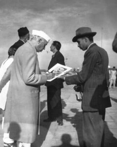 Autographing a portrait taken by the author