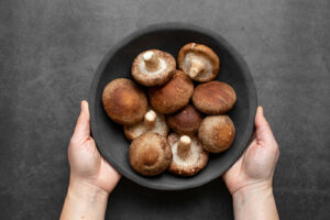 Shiitake,Mushroom,On,Dark,Background,Top,View.,Fresh,Shiitake,Mushroom