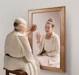 old lady looking in mirror
