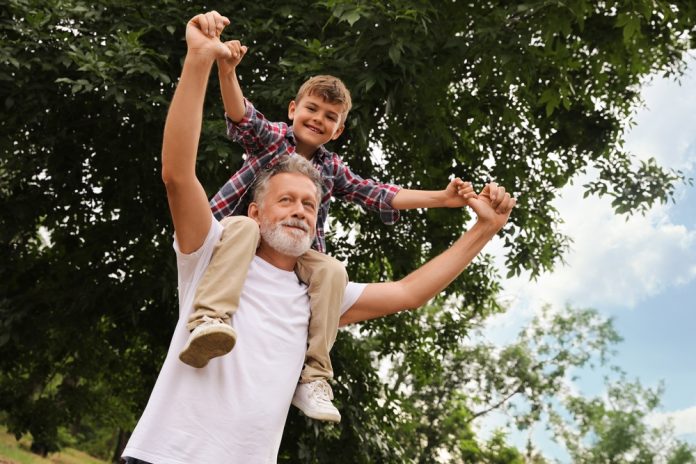 Cute,Little,Boy,And,Grandfather,Spending,Time,Together,In,Park