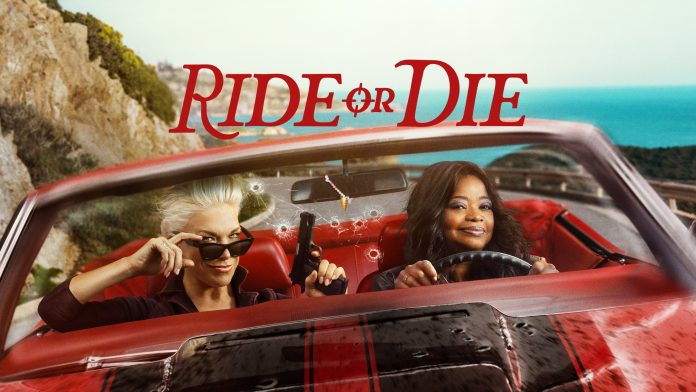 bea426afc1e77cc959fcd4f6a2a8b67d4eab2f3105e66d452a66538450fd84f4 (1) Two women drive a red convertible along a coastal highway, with bullet holes in the windshield and 'RIDE OR DIE' in red text above them.