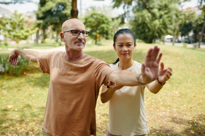 Practicing,Tai,Chi,In,Tranquil,Park,Setting,Outdoors