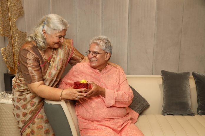 Senior,Happy,Indian,Couple,Celebrating,Anniversary,,Husband,Giving,Present,Gift